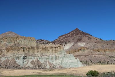 Scenic view of desert against clear sky