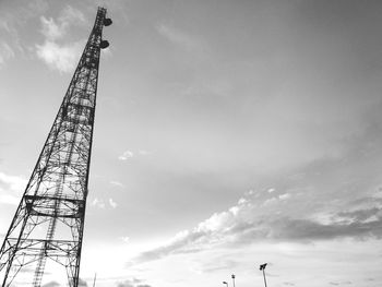 Low angle view of crane against sky