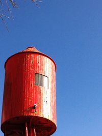 Low angle view of built structure against clear blue sky