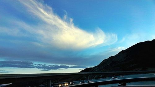 Scenic view of mountains against cloudy sky