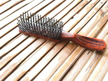 High angle view of hairbrush on table