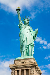 Low angle view of statue against cloudy sky