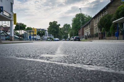 Surface level of road against sky in city