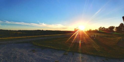 Scenic view of field against sky during sunset