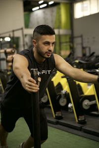 Young woman exercising in gym