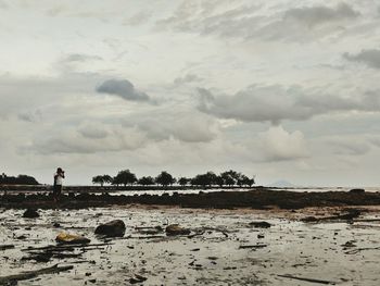 Scenic view of sea against cloudy sky