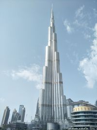 Low angle view of buildings in city against sky