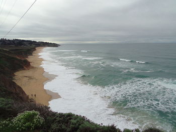 View of calm sea against cloudy sky