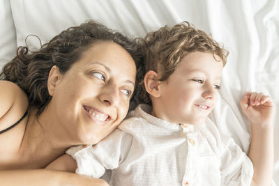 Portrait of a smiling woman lying down