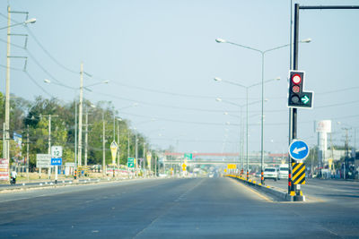 Road sign against sky