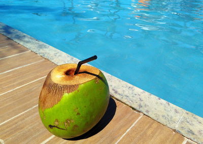 High angle view of fruit on table at swimming pool