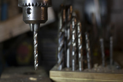 Close-up of faucet in row