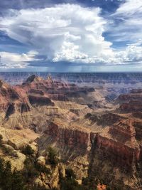 Scenic view of dramatic landscape against cloudy sky