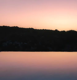 Scenic view of silhouette landscape against sky during sunset