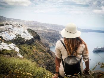 Rear view of woman looking at mountains