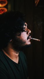 Close-up of man smoking cigarette