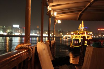 Boats in harbor at night