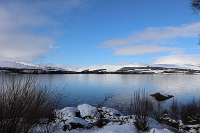 Scenic view of frozen lake against sky