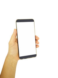 Low angle view of hand holding smart phone against white background