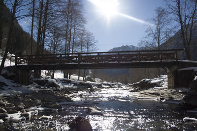 Scenic view of river against sky during winter