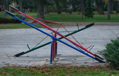Close-up of seesaw in park