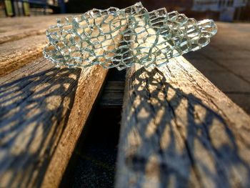 Close-up of glass decoration on wood