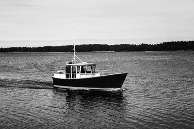 Boat in sea against sky