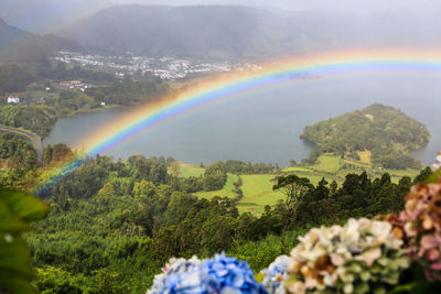 Scenic view of rainbow over mountain
