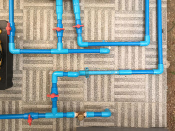 Full frame shot of metal grate against blue wall