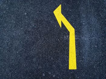 Arrow sign on road