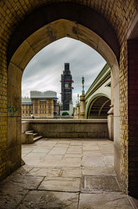 Buildings seen through arch bridge