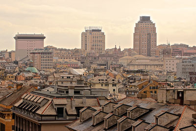 Buildings in city against sky