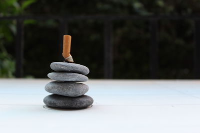 Close-up of stone stack on rock