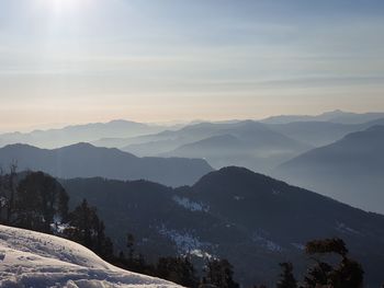 Scenic view of mountains against sky during winter