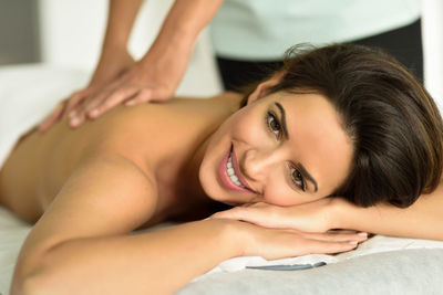 Close-up of young woman receiving massage at spa