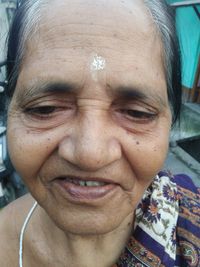 Close-up portrait of a smiling old woman