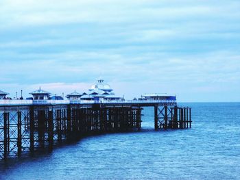 Pier over sea against sky