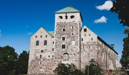 Low angle view of old building against sky