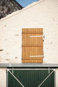 Low angle view of window on wall of building