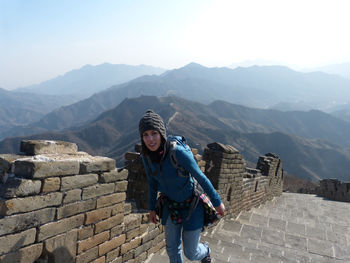 Portrait of a young man standing on mountain