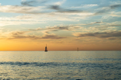 Scenic view of sea against sky during sunrise