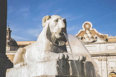 Low angle view of statue against sky