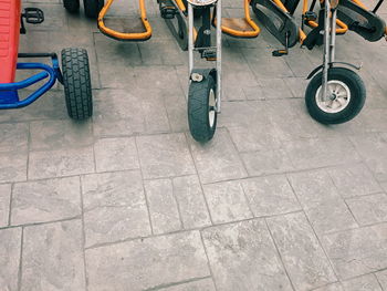 Low section of bicycles on tiled floor