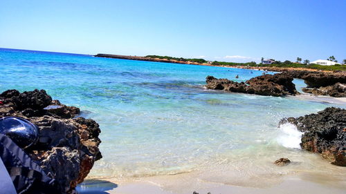 Scenic view of sea against clear blue sky