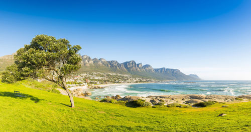 Scenic view of sea against clear blue sky