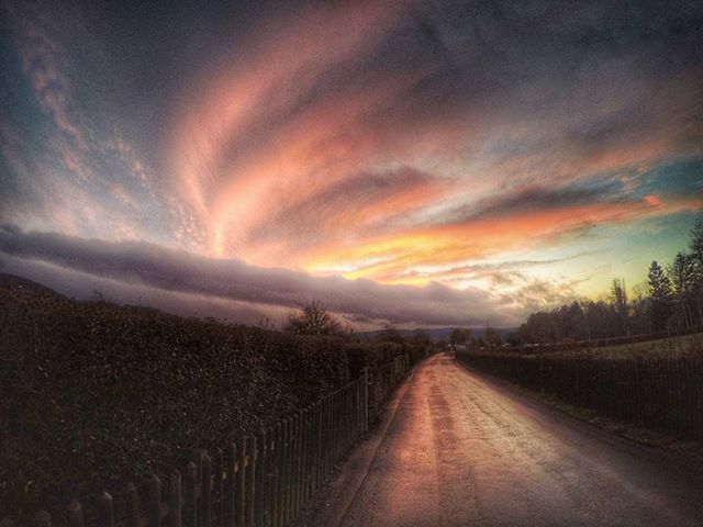 the way forward, diminishing perspective, sky, vanishing point, road, sunset, cloud - sky, tranquil scene, tranquility, transportation, country road, landscape, nature, scenics, beauty in nature, cloudy, empty road, weather, dramatic sky, dusk