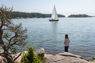 Woman fishing at lake