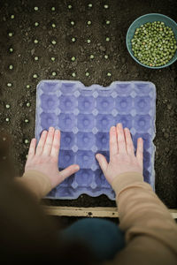 High angle view of woman standing on table