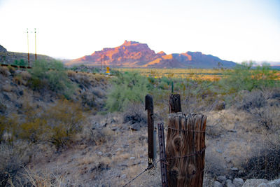 Fence on field against sky