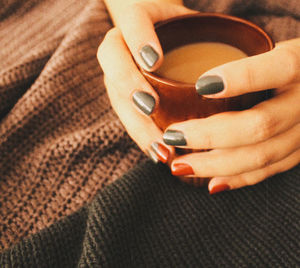 Close-up of woman holding cigarette